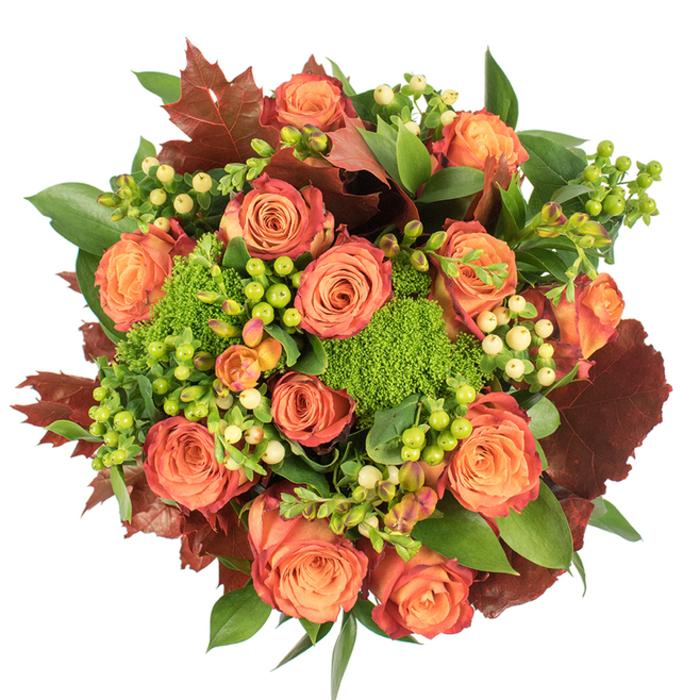 Captured from above on a crisp white field, this densely packed autumn bouquet was crafted to evoke the changeable beauty of fall in Colliers Wood and the surrounding Wandle Valley. The eye is drawn to a halo of large, fully bloomed roses whose petals graduate from a warm peach-orange at the heart to deeper coral and russet tones toward the edges, some petals kissed with a reddish-rust rim that mirrors turning leaves. Nestled among these classic blooms are vivid green Green Trick dianthus clusters-soft, spherical, moss-like textures that provide a lively, tactile contrast to the smooth rose petals. Small groups of Hypericum berries-some bright lime-green, others a pale creamy yellow-dot the arrangement, their glossy, rounded forms adding fresh punctuation and varied texture. Interspersed with these are expansive, broad green leaves and more sculptural lobed foliage in deep burgundy and burnt orange, chosen to reinforce the seasonal narrative and to anchor the composition visually. The lighting is tenderly diffuse, highlighting velvety petals, the matte plushness of the dianthus, and the glossy sheen of berries while casting soft shadows that emphasize depth and craftsmanship. There is an imagined fragrance of warm rose blended with earthy, mossy notes. Hand-assembled by an experienced florist, this bouquet reads as an elegant Thanksgiving centerpiece, a cozy autumnal table accent, or a thoughtful gift for neighbours across Colliers Wood, near Merton Abbey Mills and South Wimbledon. Florists Colliers Wood prepares and arranges such seasonal designs with attention to local tastes and fresh-market sourcing.